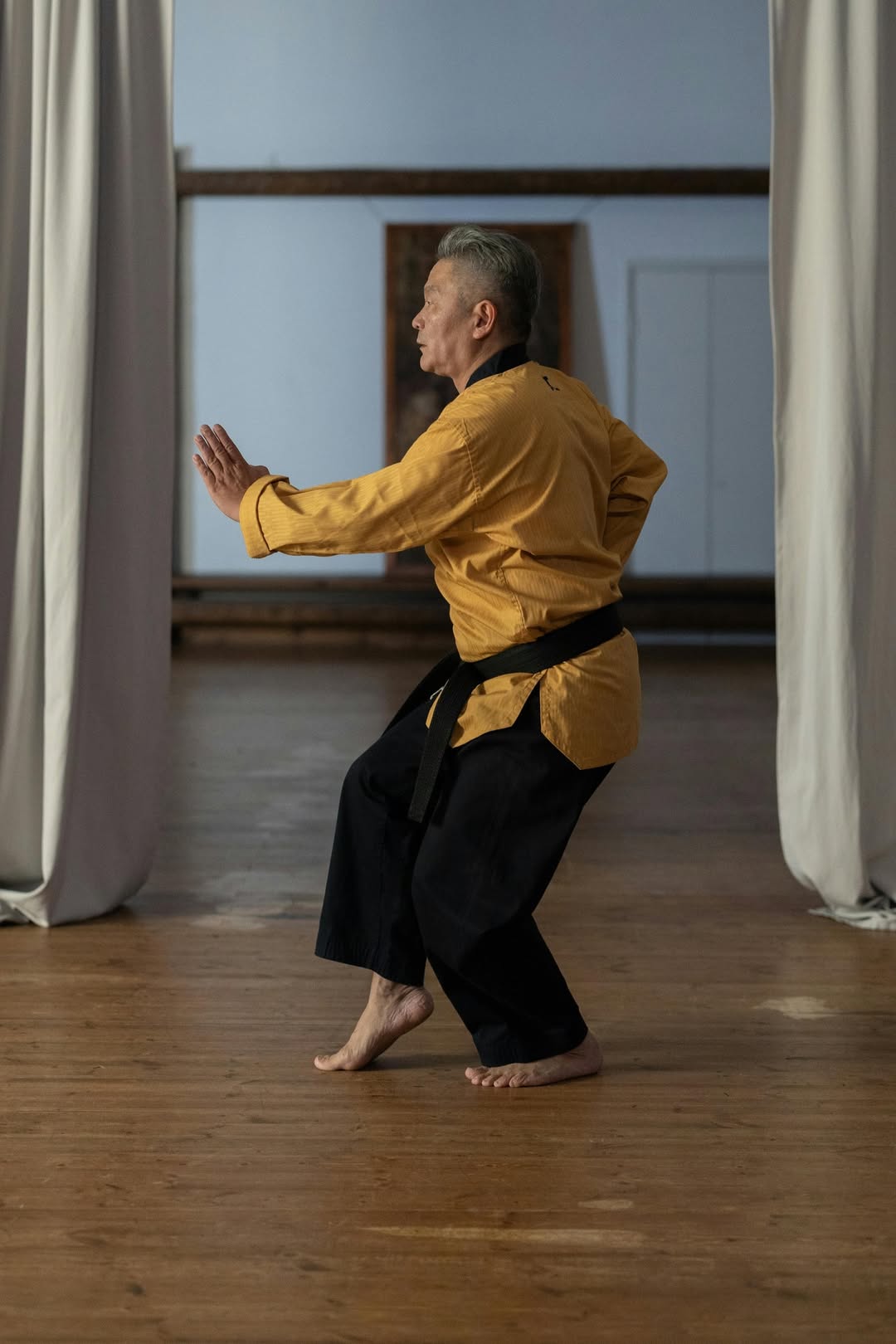 an old man training his martial art