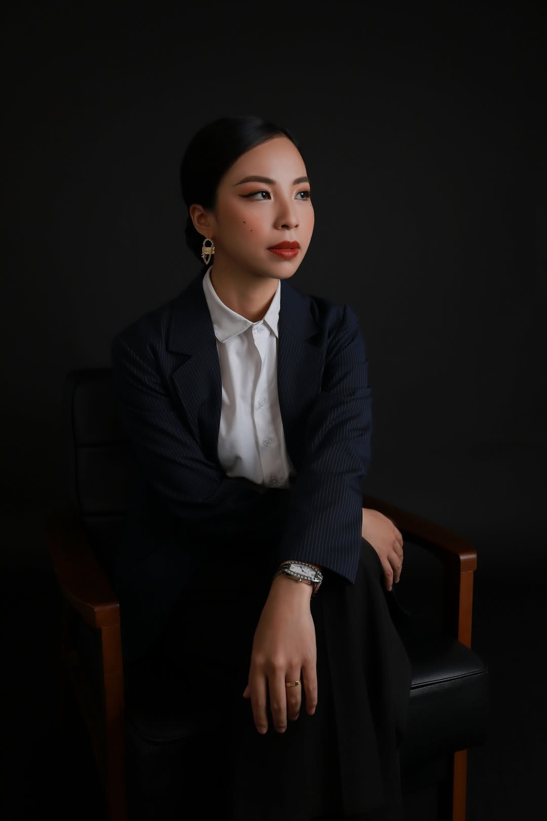 Portrait of a woman posing in a business suite